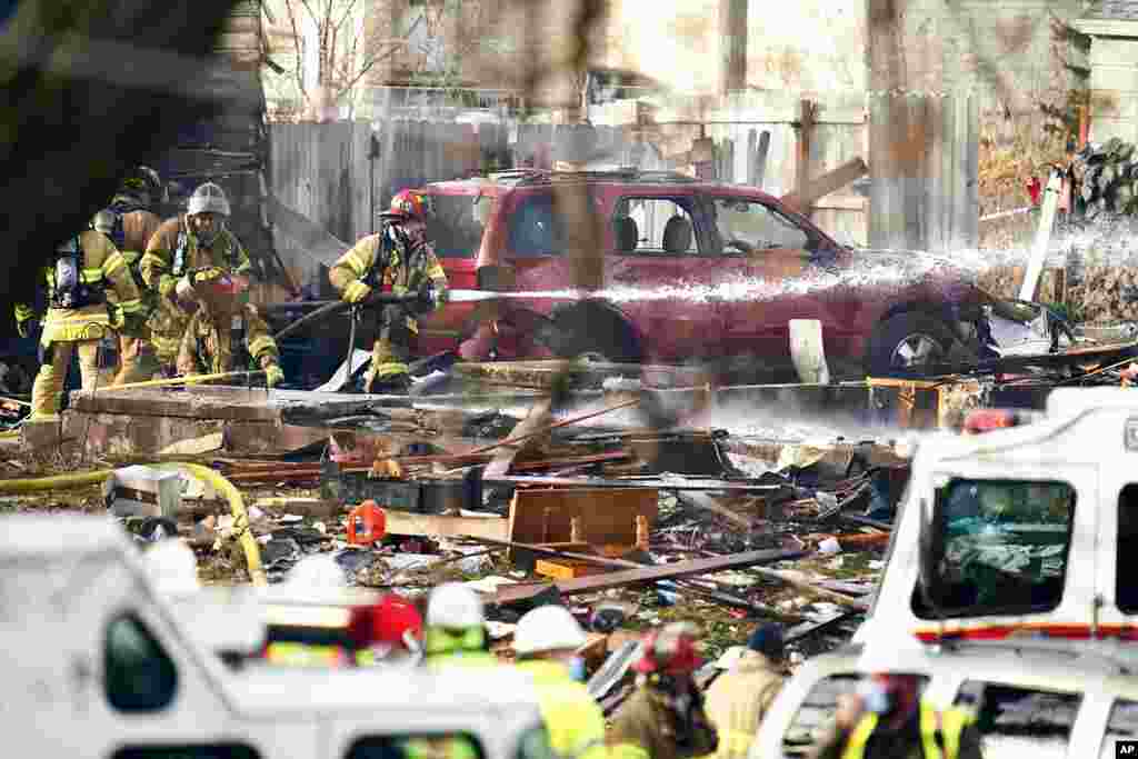 Firefighters work following a deadly explosion that destroyed a home in Omaha, Nebraska.