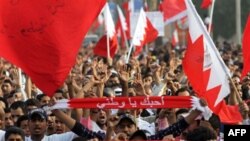 Anti-government protesters march in a parade welcoming newly released political prisoners to the Pearl roundabout in Manama, Bahrain, February 23, 2011