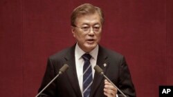 FILE - South Korean President Moon Jae-in delivers a speech at the National Assembly in Seoul, South Korea.