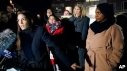 Rep.-elect Alexandria Ocasio-Cortez, left, speaks at a small rally outside an orientation meeting for incoming members of Congress at Harvard University. Rep.-elect Ayanna Pressley, right, and Rep.-elect Lori Trahan, second from right, look on in Cambridge, Mass., Dec. 4, 2018.