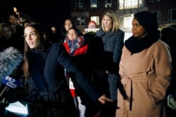 Rep.-elect Alexandria Ocasio-Cortez, D-N.Y.,, left, speaks at a small rally outside an orientation meeting for incoming members of Congress at Harvard University as Rep.-elect Ayanna Pressley, D-Mass., right, and Rep.-elect Lori Trahan, D-Mass. (AP Photo)