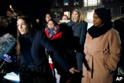 Rep.-elect Alexandria Ocasio-Cortez, D-N.Y.,, left, speaks at a small rally outside an orientation meeting for incoming members of Congress at Harvard University as Rep.-elect Ayanna Pressley, D-Mass., right, and Rep.-elect Lori Trahan, D-Mass. (AP Photo)