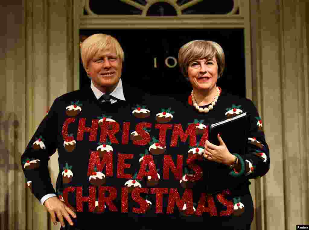 Wax figures of Britain's Prime Minister Theresa May and Foreign Secretary Boris Johnson are displayed in London's Madame Tussauds Museum.