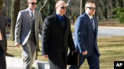 FILE - Officer Edward Nero, from left, Lt. Brian Rice and Officer Garrett Miller three of six Baltimore city police officers charged in connection to the death of Freddie Gray, arrive to Maryland Court of Appeals on March 3, 2016, in Annapolis, Md. 