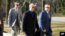 Officer Edward Nero, from left, Lt. Brian Rice and Officer Garrett Miller three of six Baltimore city police officers charged in connection to the death of Freddie Gray, arrive to Maryland Court of Appeals on March 3, 2016, in Annapolis, Md. 