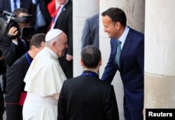 Pope Francis is greeted by Irish Prime Minister Leo Varadkar at Dublin Castle during his visit to Dublin, Ireland, Aug. 25, 2018.