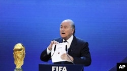 FIFA President Sepp Blatter announces the World Cup host countries for 2018 and 2022 at the federation's headquarters in Zurich, 02 Dec 2010