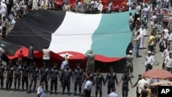 Followers of the Jordanian Muslim Brotherhood march in Amman, demanding more political reforms, July 13, 2012.