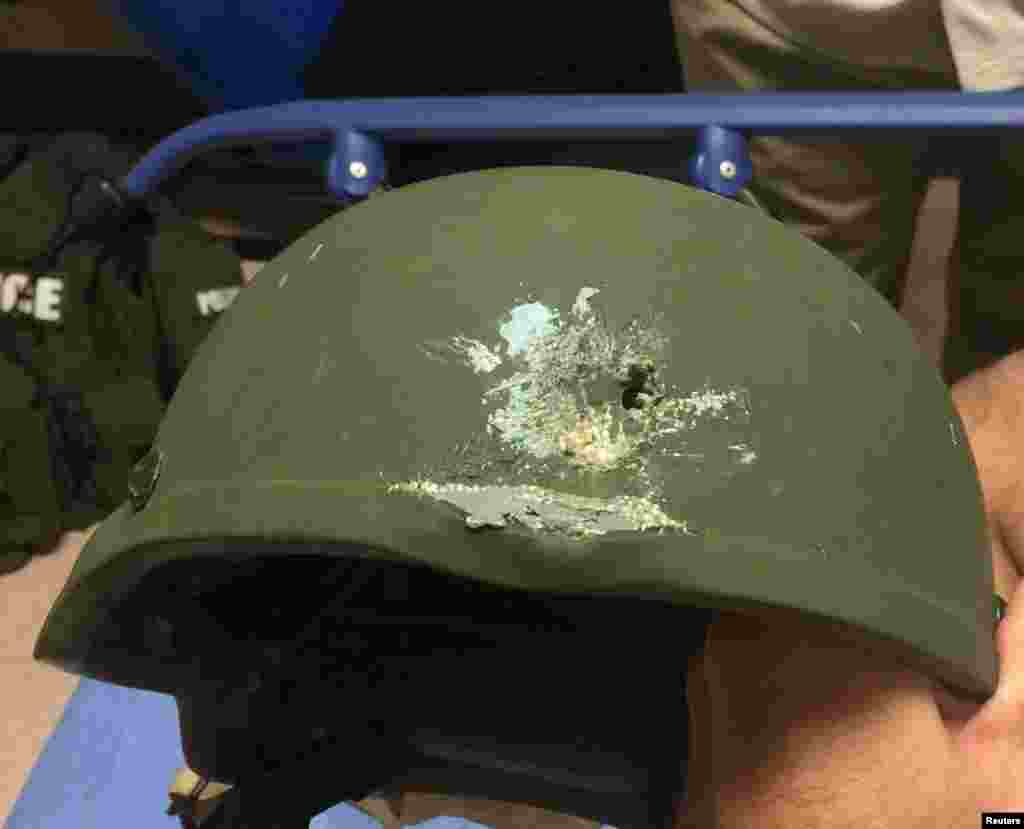 A handout photograph posted by the Orlando Police Department on Twitter with the words, &quot;Pulse shooting: In hail of gunfire in which suspect was killed, OPD officer was hit. Kevlar helmet saved his life&quot;, in reference to the operation against a gun man inside Pulse night club in Orlando, Florida on June 12, 2016.