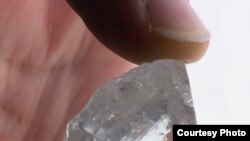 FILE: A diamond recovered from a mine northeast of Pretoria, South Africa, described as an exceptional 232.08ct white Cullinan stone. Taken 8.30.2014
