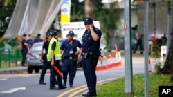 Police step up security around the venue of the international security conference in Singapore following a shootout at a roadblock in which officers fatally shot one man and detained two others, May 31, 2015. 