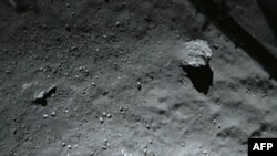 A handout photo released on November 13, 2014 by the European Space Agency, and taken by the Rosetta Lander Imaging System instrument, shows the surface of comet 67P/Churyumov-Gerasimenko during Philae's descent. 