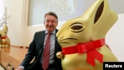 Ernst Tanner, CEO of Swiss chocolatier Lindt & Spruengli poses beside a giant 'Goldhase' rabbit in Kilchberg near Zurich, Switzerland. Mar, 15, 2011.