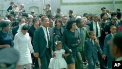 Coretta Scott King, center, widow of slain civil right Dr. Martin Luther King, Jr. walk in the funeral procession, Atlanta, Ga., April 9, 1968.