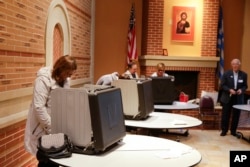 Voters cast their ballots in the Indiana primary at Holy Trinity Greek Orthodox Church in Carmel, Indiana, May 3, 2016.