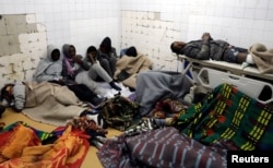 Migrants who were injured in a truck crash are seen at a hospital in Bani Walid town, Libya, Feb. 14, 2018.