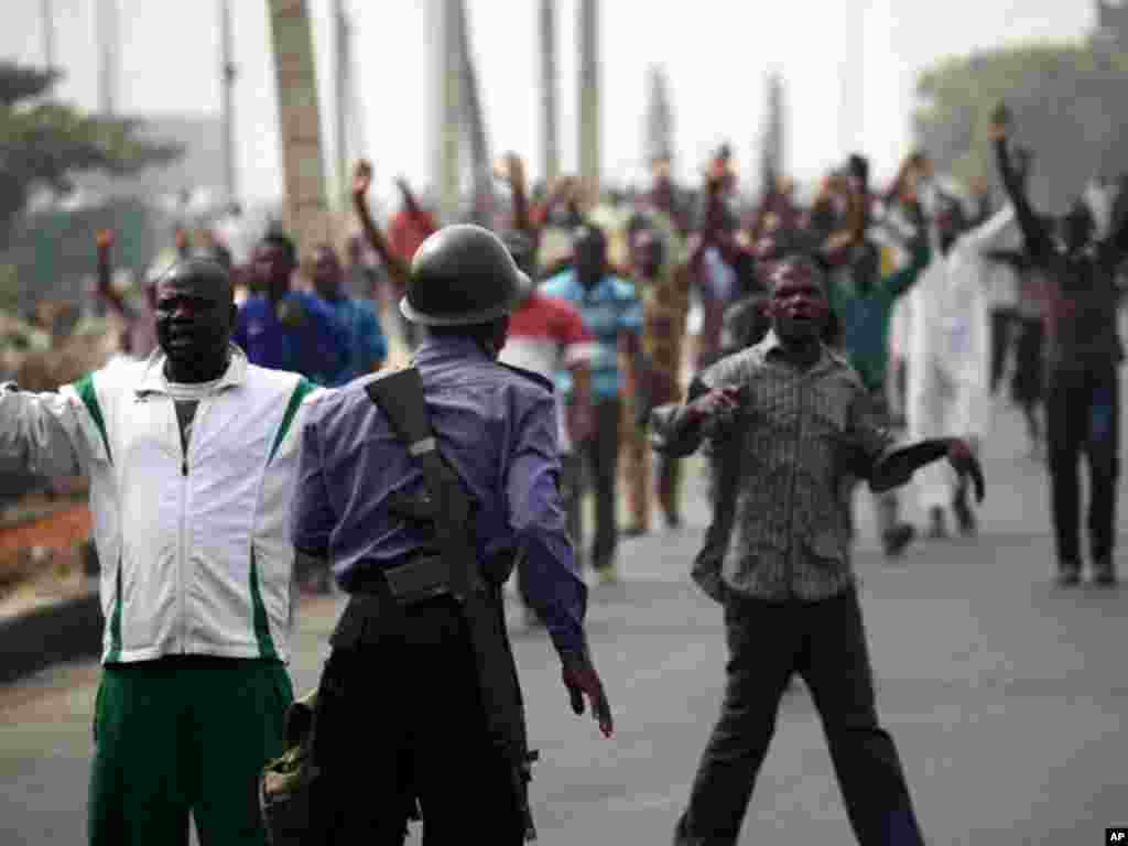 A soldier guards a road during an operation to disperse people protesting against the removal of fuel subsidies in Lagos on January 16, 2012. (Reuters)