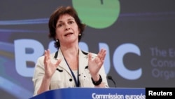 FILE - Monique Goyens, head of the BEUC, the European consumer organization, addresses a joint news conference with European Climate Action Commissioner Connie Hedegaard of Denmark (not pictured) at the EU Commission headquarters in Brussels.