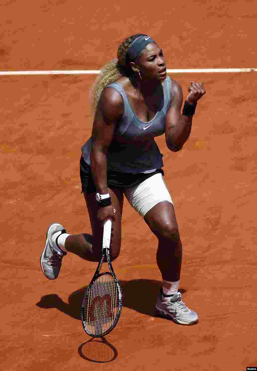 Serena Williams of the U.S. celebrates winning a point during her match against Carla Suarez Navarro of Spain at the Madrid Open tennis tournament, Spain.