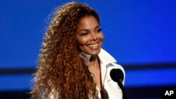 FILE - Janet Jackson accepts the ultimate icon: music dance visual award at the BET Awards in Los Angeles. 