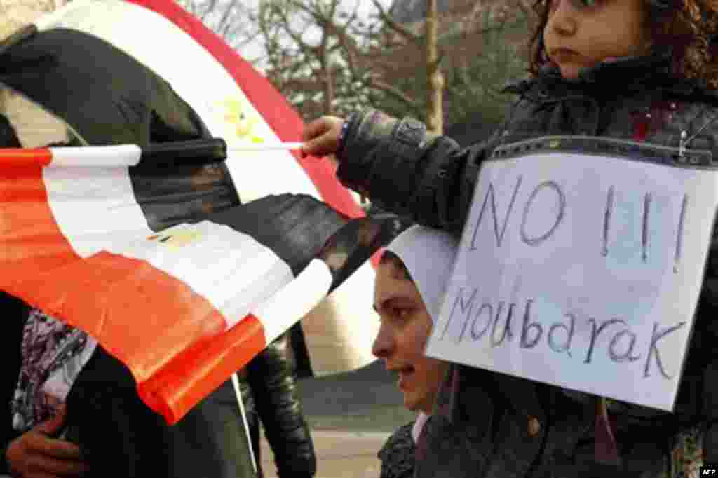 Demonstrators gather during a protest against Egyptian President Hosni Mubarak outside the Egyptian embassy in Paris, Monday, Jan. 31, 2011. Dozens of protestors gathered in a show of support for protests currently taking place in Egypt. (AP Photo/Francoi