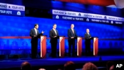 Republican presidential candidates, from left: Bobby Jindal, Rick Santorum, George Pataki, and Lindsey Graham take the stage during the CNBC Republican presidential debate at the University of Colorado, Oct. 28, 2015.