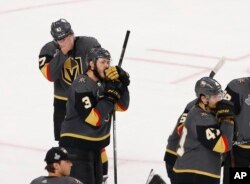 Members of the Vegas Golden Knights watch the Stanley Cup ceremony after the Capitals defeated the Golden Knights 4-3 in Game 5 of the NHL hockey Stanley Cup Finals, June 7, 2018, in Las Vegas.