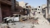 Bombs Kill 22 Iraqis Near Baghdad