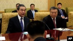 Chinese Foreign Minister Wang Yi, left, meets with North Korean officials, not pictured, at the Mansudae Assembly Hall in Pyongyang, North Korea, May 2, 2018.
