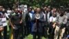 Former Zimbabwean Prime Minister Morgan Tsvangirai addresses activists in Harare protesting the disappearance a year ago of Itai Dzamara, March 9, 2016. He said the case represented "the unacceptable face" of Robert Mugabe's government. (S. Mhofu/VOA)