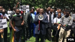 Former Zimbabwean Prime Minister Morgan Tsvangirai addresses activists in Harare protesting the disappearance a year ago of Itai Dzamara, March 9, 2016. He said the case represented "the unacceptable face" of Robert Mugabe's government. (S. Mhofu/VOA)
