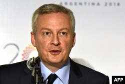 French Economy Minister Bruno Le Maire delivers a speech during a news conference during the G-20 meeting of finance ministers and central bank governors, in Buenos Aires, March 20, 2018.