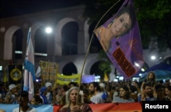 Demonstrators take part in a protest against the shooting of Rio de Janeiro City Councillor Marielle Franco one month after her death, in Rio de Janeiro, Brazil, April 14, 2018.