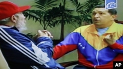 Image from video shown on Cuban state television shows Cuba's Fidel Castro, (l) speaking with Venezuela's President Hugo Chavez in an unknown location in Havana, June 28, 2011