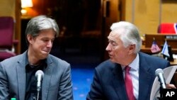 Cyber Ninjas CEO Doug Logan, left, listens to Randy Pullen, former Chairman of the Arizona Republican Party and current Senate Audit spokesperson, prior to the Arizona Senate Republicans hearing review of the 2020 presidential election results Sept. 24, 2021, in Phoenix.