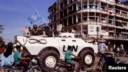 FILE PHOTO: UN peacekeepers patrol the streets of Phnom Penh in an armoured personnel carrier, Cambodia August 27, 1993.