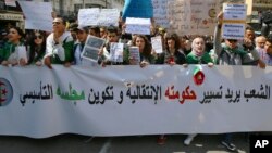 Algerian demonstrators march during a protest in Algiers, Apr. 2, 2019. Algerian protesters and political leaders are expressing concerns that ailing President Abdelaziz Bouteflika's departure will leave the country's secretive, distrusted power structure