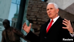 U.S. Vice President Mike Pence speaks next to the Warsaw Uprising Monument in Warsaw, Poland, Feb. 14, 2019.