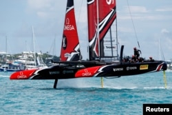 FILE - Peter Burling, Emirates Team New Zealand Helmsman takes his team and boat to the finish line to defeat Oracle Team USA in race nine to win the America's Cup.