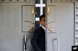 FILE - A security guard walks in the Saudi Arabia consulate in Istanbul, Oct. 9, 2018.