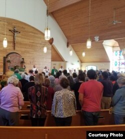 Rapid City Catholic diocese Bishop Robert D. Gruss, seen at an Oct. 21, 2017 Mass at Holy Rosary Church, Pine Ridge, S.D., formally opening sainthood cause for Nicholas Black Elk. (Courtesy: Keith Janis)