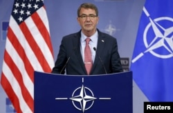 U.S. Defense Secretary Ash Carter addresses a news conference during a NATO defense ministers meeting at the alliance headquarters in Brussels, Belgium, Oct. 8, 2015.