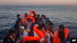 Refugees and migrants overcrowd a wooden boat during a rescue operation on the Mediterranean sea, about 19 miles north of Az Zawiyah, Libya on July 21, 2016.