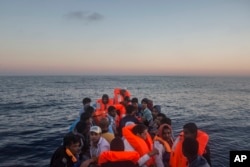 Refugees and migrants overcrowd a wooden boat during a rescue operation on the Mediterranean sea, about 19 miles north of Az Zawiyah, Libya on July 21, 2016.