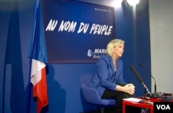 FILE - Marine Le Pen of France's far-right National Front party is seen speaking at a press conference (L. Bryant/VOA). Seen as a viable presidential candidate, Le Pen wants to close borders, end immigration and hold a ‘Frexit’ referendum on leaving the EU.