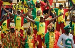 Senegal's fans cheer before the start of the African Cup of Nations 2022 group B soccer match between Senegal and Guinea at the Omnisport Stadium in Bafoussam, Cameroon, Jan. 14, 2022.