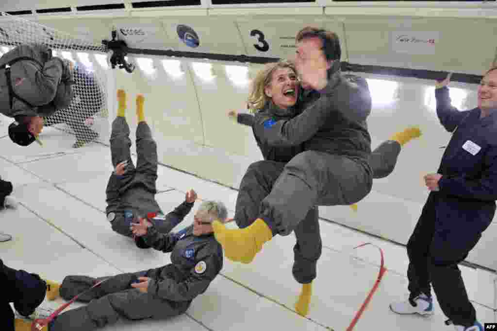 Civilian passengers of the Airbus A330 Zero-G, who are not astronauts nor scientists, enjoy the weightlessness during the first zero-gravity flight for paying passengers in Europe. All boarding cards, costing 6,000 euros, were sold for the years 2013 and 2014.