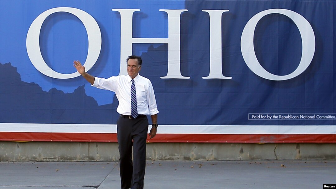 Mitt Romney waves to the crowd at a campaign stop in Worthington, Ohio, Oct. 25, 2012.