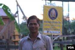 Long Sophat, 50, the second deputy Orey commune chief from Funcinpec party, led by prince Norodom Ranaridh, stands in front of his house along the main road, on October 19, 2017. (Sun Narin/VOA Khmer)