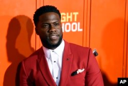 FILE - Kevin Hart poses at the premiere of the film "Night School" in Los Angeles, Sept. 24, 2018.